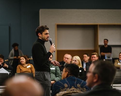 Ma speaking at event in front of crowd