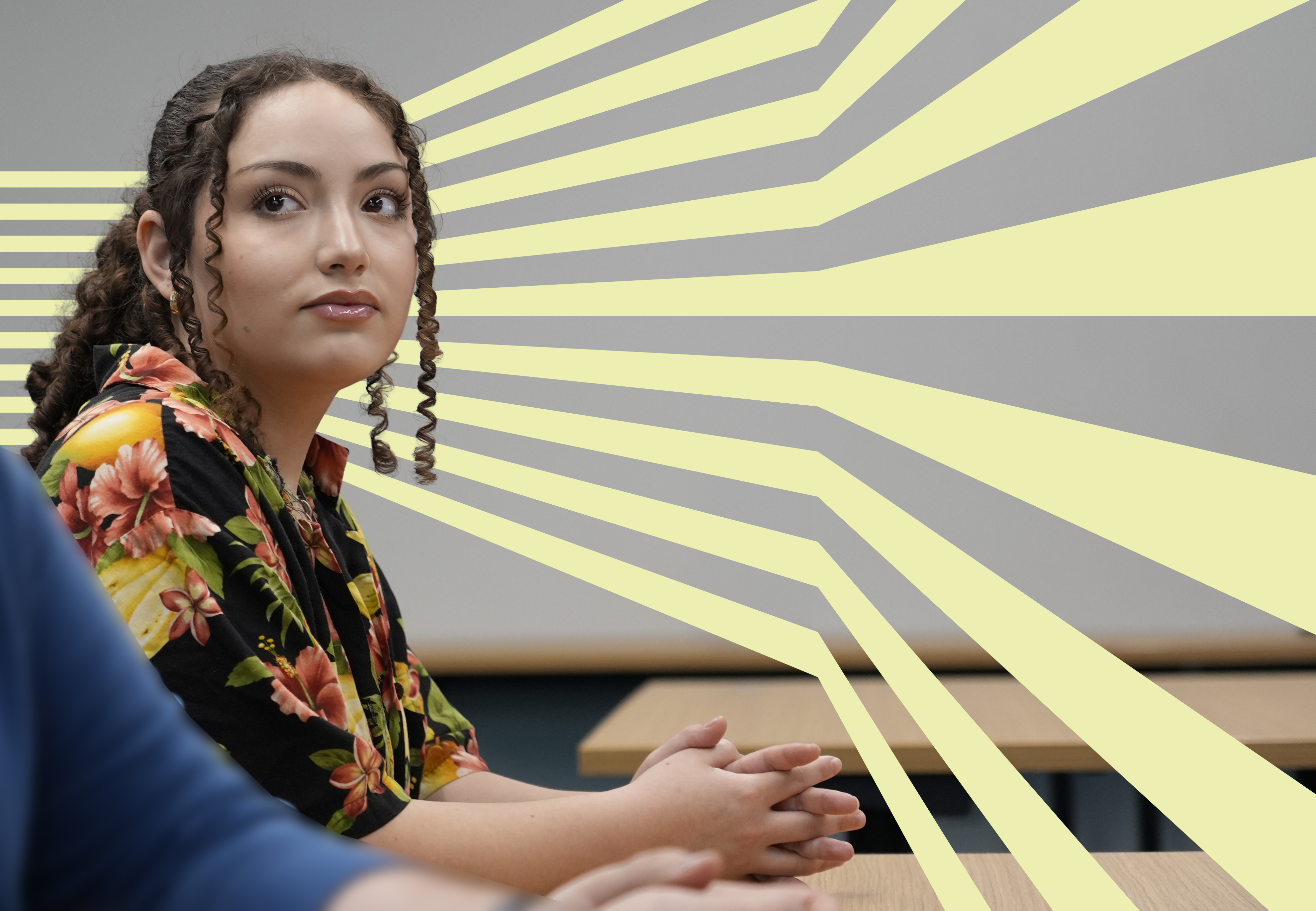 Student listening at a desk