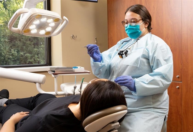 Dental EFDA assisting a patient