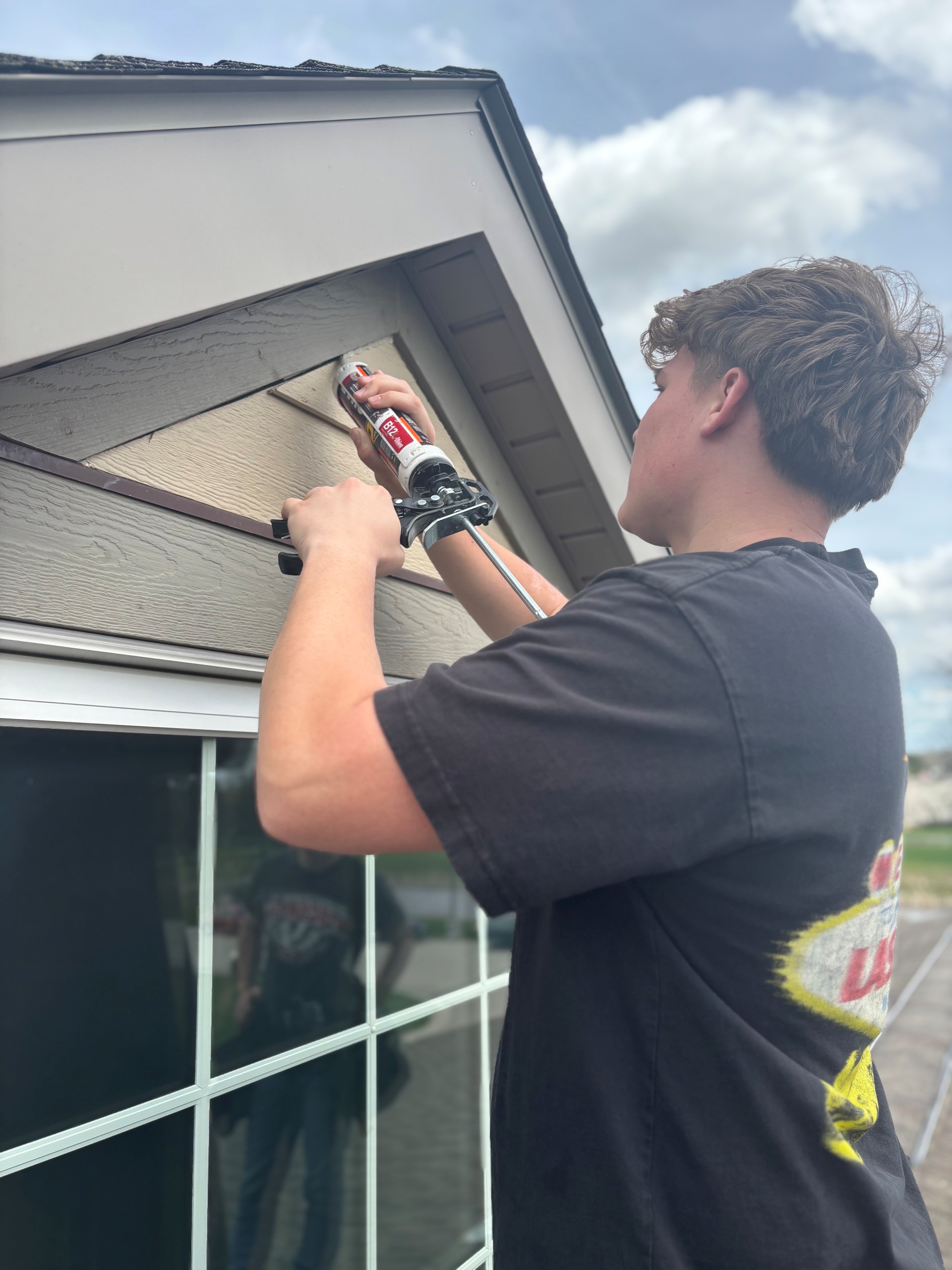 Student fixing window