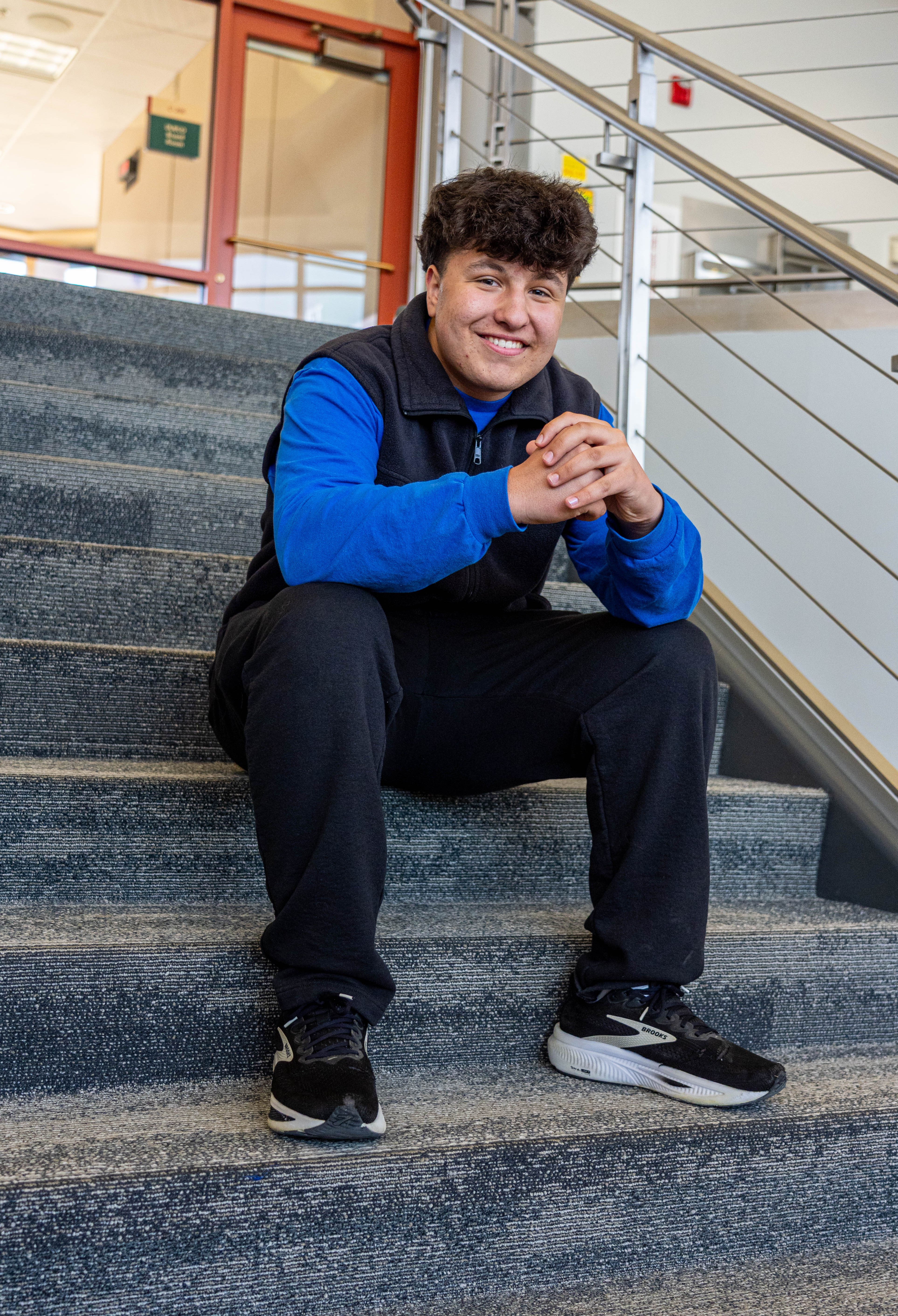 student sitting on steps