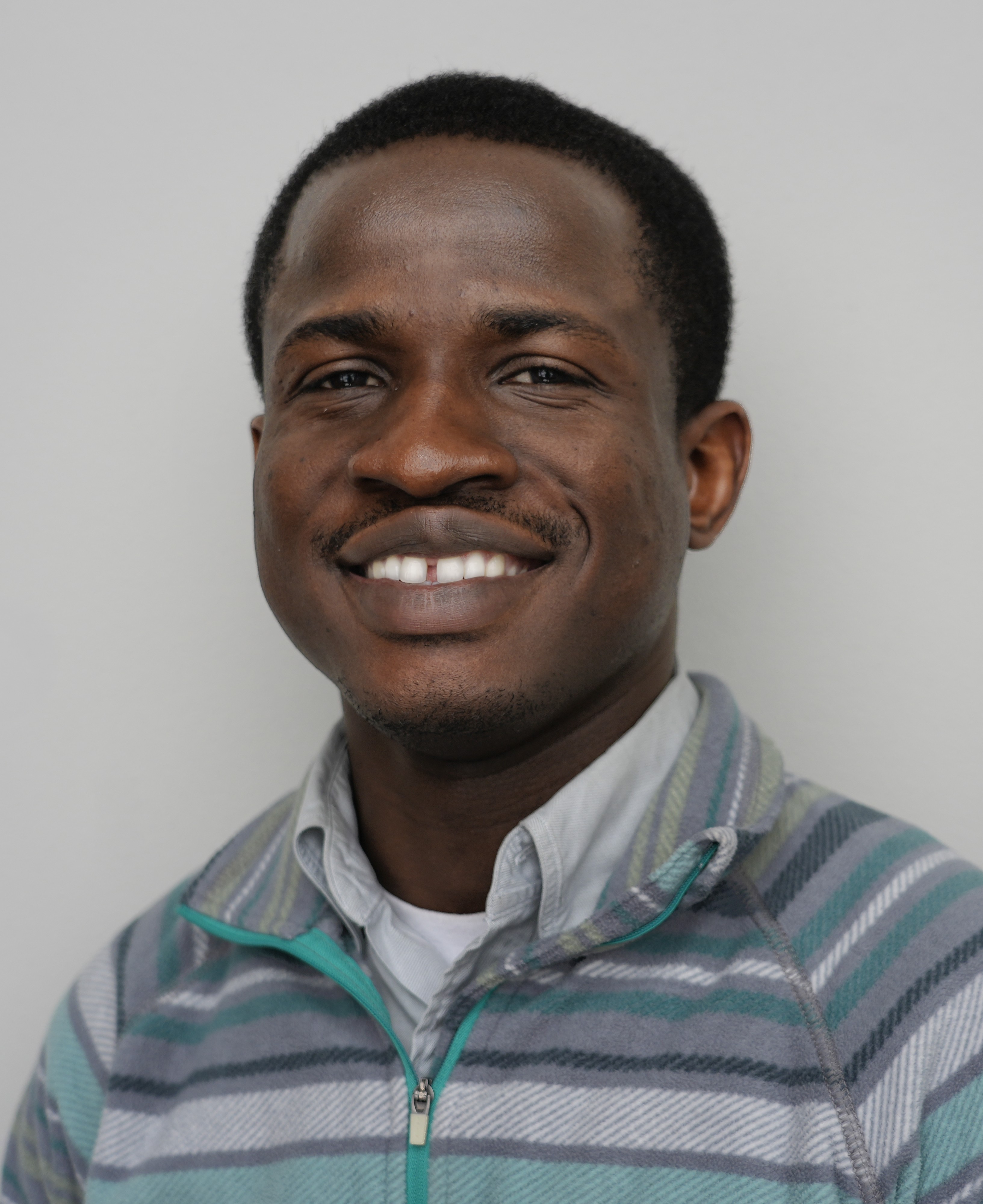 Headshot of man smiling, new AI project manager