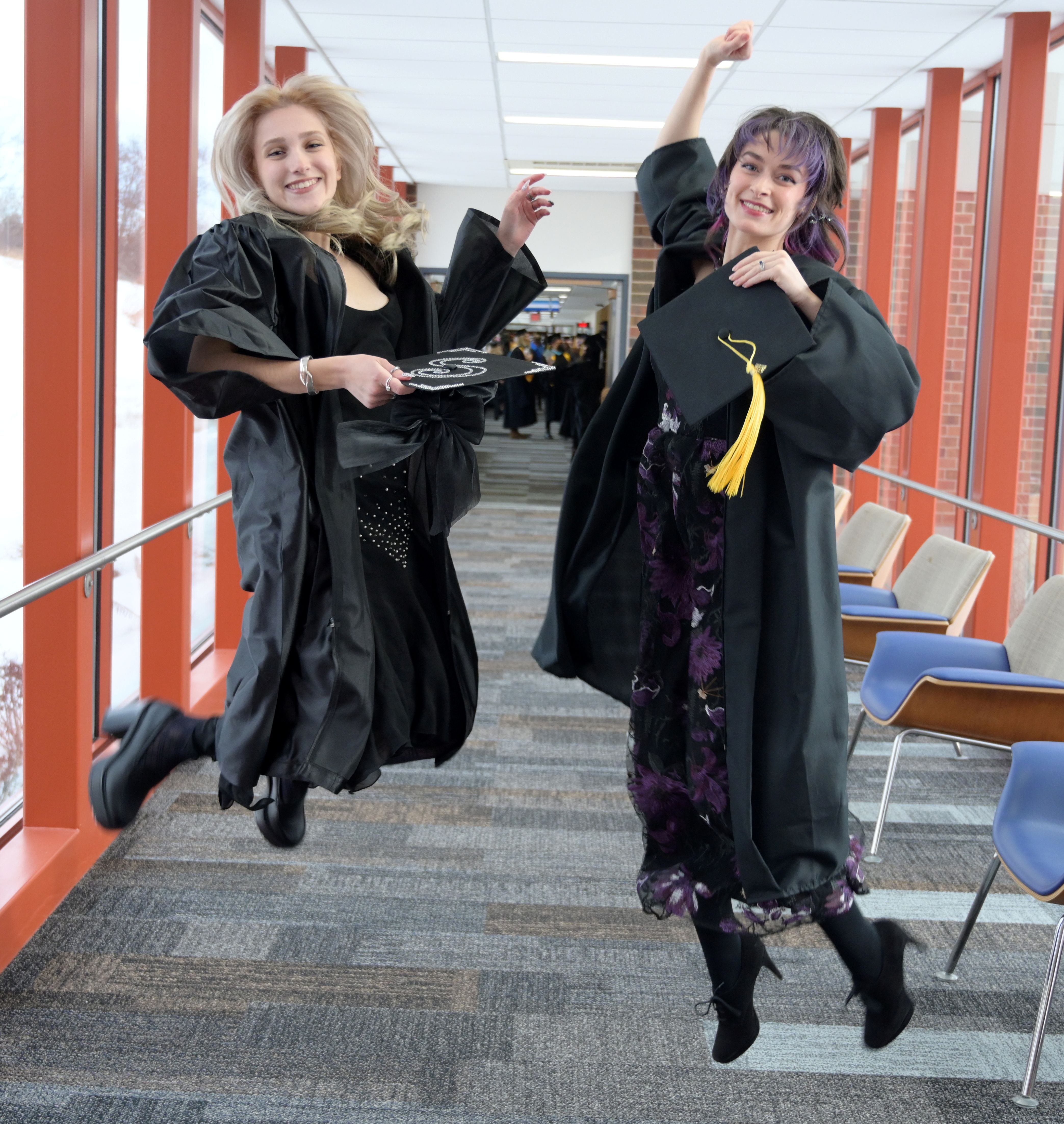 Two jumping graduates - female