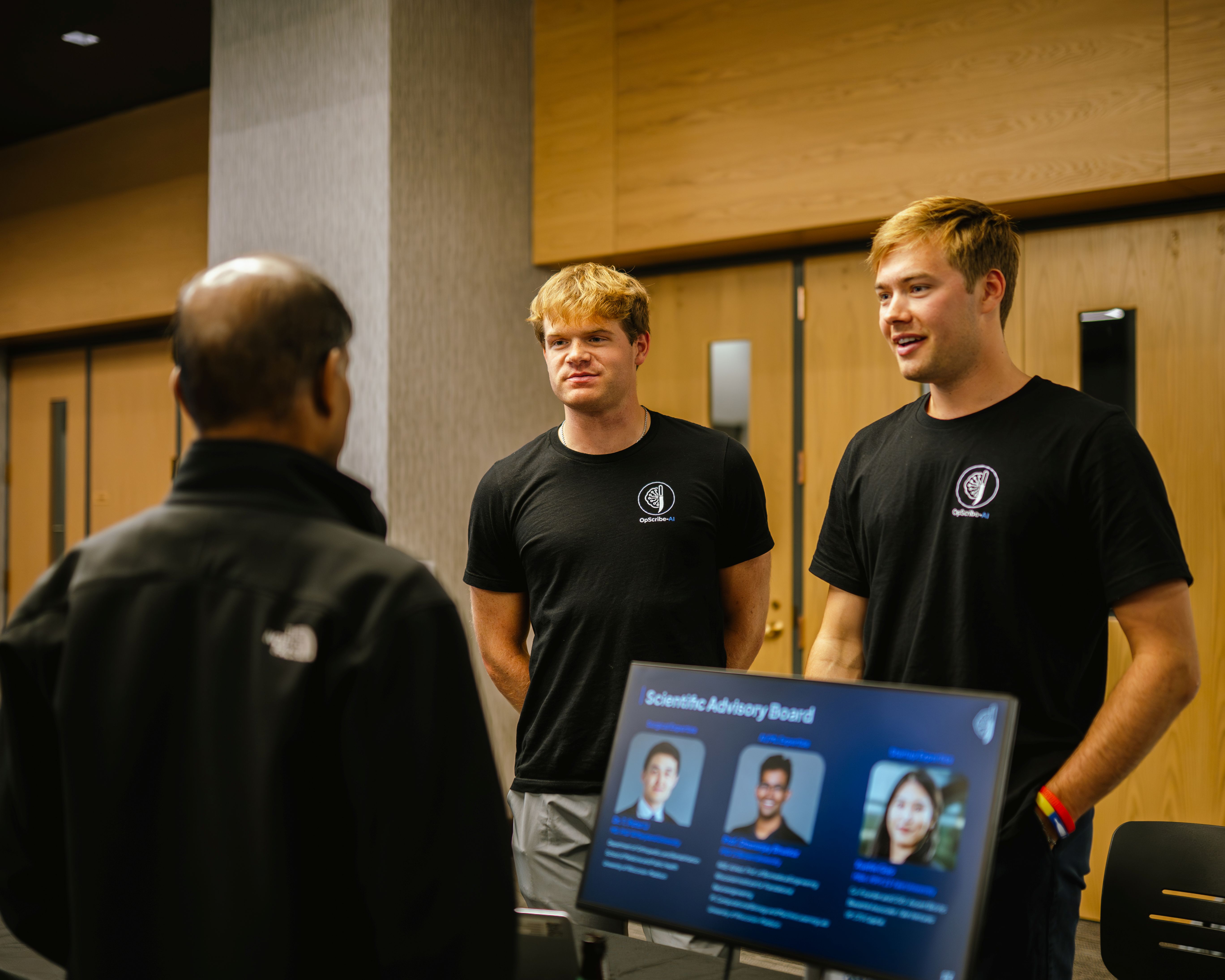 gBETA male participants talking to guest