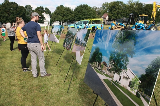 Guests looking at Habitat Waukesha renderings