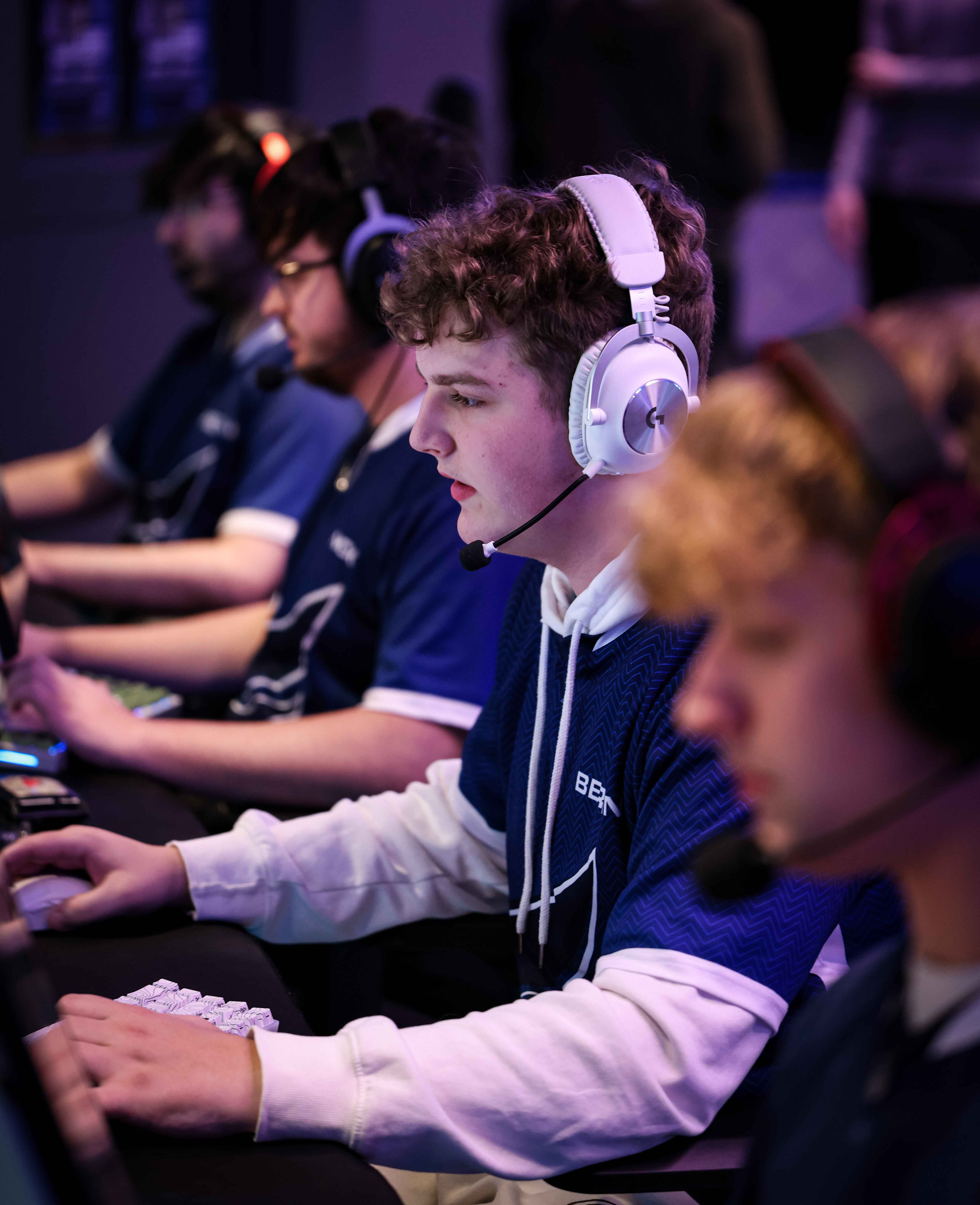 E-sports players concentrating on their screens