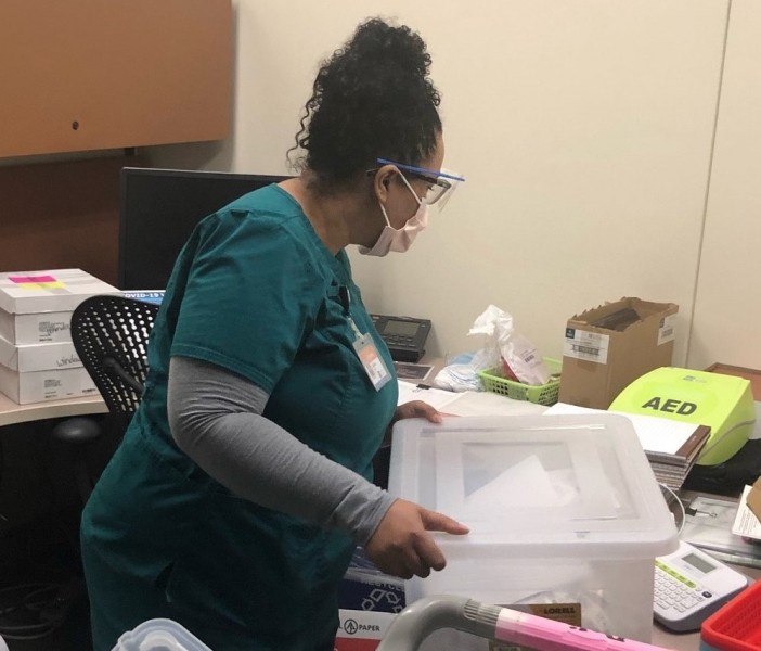 Student nurse working at vaccine clinic