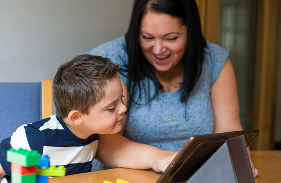 teacher and student with tablet